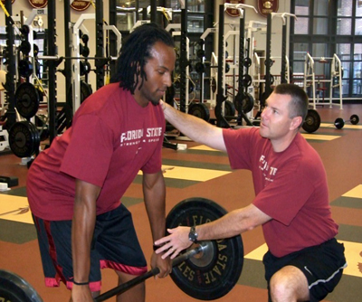From FSU Athletics, Director of Strength and Conditioning Jon Jost, right, an adviser to the new Institute of Sports Sciences and Medicine, assists graduate student Brandon Sanders, who is pursuing a master's degree in exercise science with a focus on sports sciences.