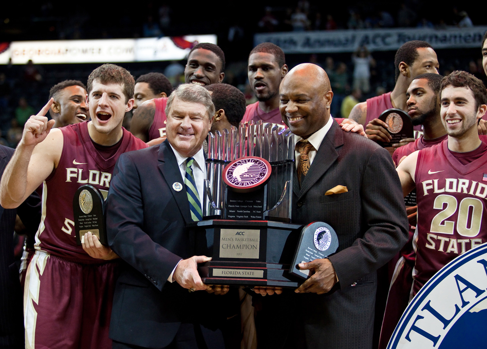 ACC Commissioner John Swafford presents the championship trophy to Coach Leonard Hamilton and the FSU men's basketball team. (All photos by Ross Obley/Seminoles.com)