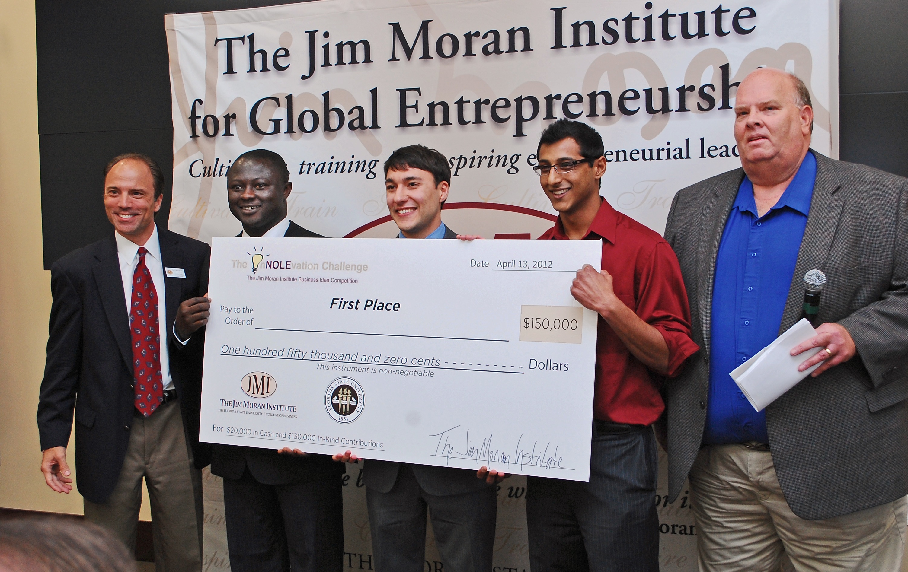 Winners of the InNOLEvation challenge and a $150,000 grand prize are, second from left, Aubrey Kusi-Appiah and Nicholas Vafai, both biological science graduate students, and Sohail Merchant, a senior in biological science. At far left is Tim Holcomb, executive director of The Jim Moran Institute for Global Entrepreneurship, and at far right is Ron Frazier, entrepreneur-in-residence at The Jim Moran Institute and InNolevation Challenge adviser.