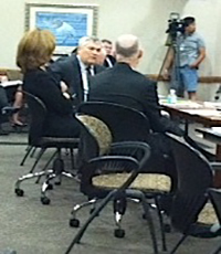Florida State President Eric J. Barron, center (facing camera), speaks with Gov. Rick Scott during the April 12 meeting.