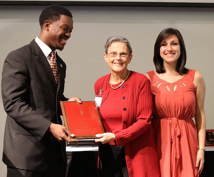 Linda Mahler accepts the 2012 Ross Oglesby Award from members of Garnet and Gold Key. (photo by Damon Herota)