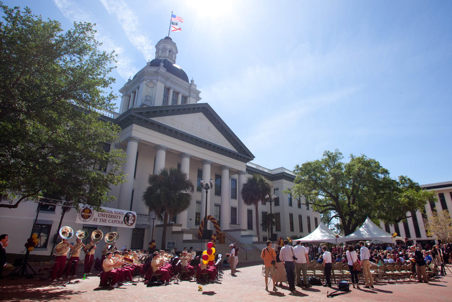 Florida State's Chiefly Brass perform on the plaza between the old and new Florida Capitols.