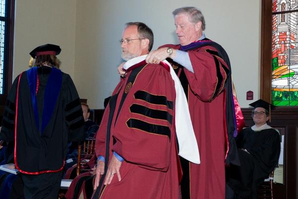 President Thrasher hoods Christopher Still with an Honorary Doctor of Humane Letters from Florida State University.