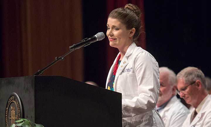 Dr. Rachel Bixler, a family practitioner and alumnus, addresses FSU's 121 new medical students Friday, Aug. 12.