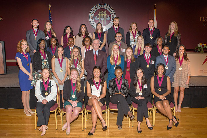 President John Thrasher and the new inductees of the Garnet and Gold Scholar Society.