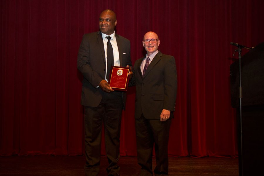 Okenwa Okoli, professor of engineering at the FAMU-FSU College of Engineering, receives the 2017 Dr. Martin Luther King Jr. Award from past recipient Bruce Lamont at the 29th Annual MLK Celebration Tuesday, Jan. 17. Photo credit: Lauren Alsina