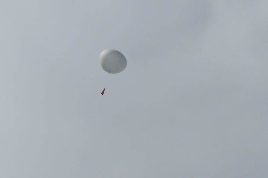 Success! On the third launch attempt, the weather balloon takes flight and soars across St. Maarten.