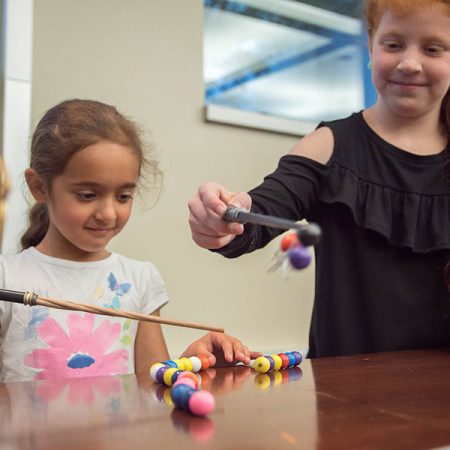 At this year’s movie-themed MagLab Open House, visitors can use Potteresque “magnet wands” to explore how magnets work. Photo credit: Stephen Bilenky/National MagLab.