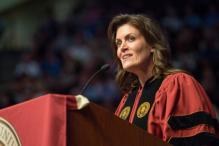 Alumna Wendy Clark delivers the commencement address to graduates during Friday night's ceremony.