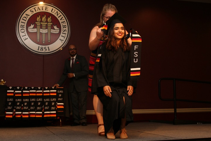 Graduate Rona Akbari receives a stole at the at the V-rak-ke-ce-tv Cultural Graduation Ceremony on May 4, 2017.