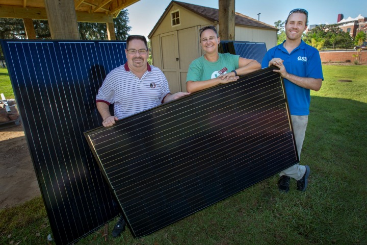 (Left to right) Chris Diaz, the principal and executive vice president of Business Development for Seminole Financial Services and a 1988 graduate of the FSU College of Social Sciences and Public Policy, Elizabeth Swiman director of FSU Sustainable Campus, and Justin Vandenbroeck, a senior project developer at ESA Renewables and a 2014 graduate of the FAMU-FSU College of Engineering. (Photo: FSU Photography Services)