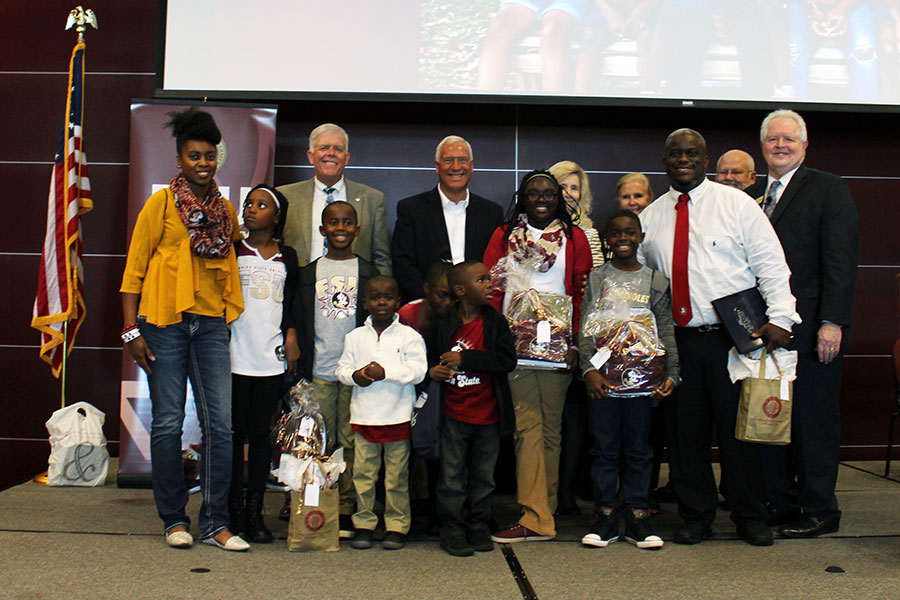 FSU Panama City Dean Randy Hanna, Chipola College President Sarah Clemmons and Gulf Coast State College President John Holdnak awarded each child of the Olds family with guaranteed scholarships Aug. 17 at FSU Panama City’s Welcome Back Symposium.