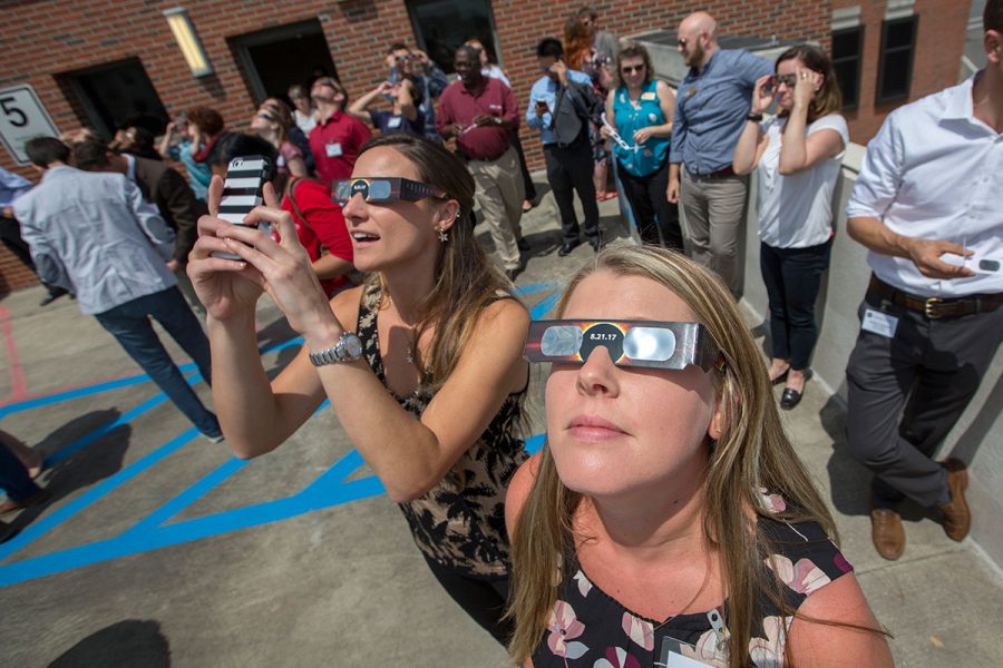 Faculty and staff check out the solar eclipse at New Faculty Orientation on Aug. 21, 2017. (FSU Photography Services)