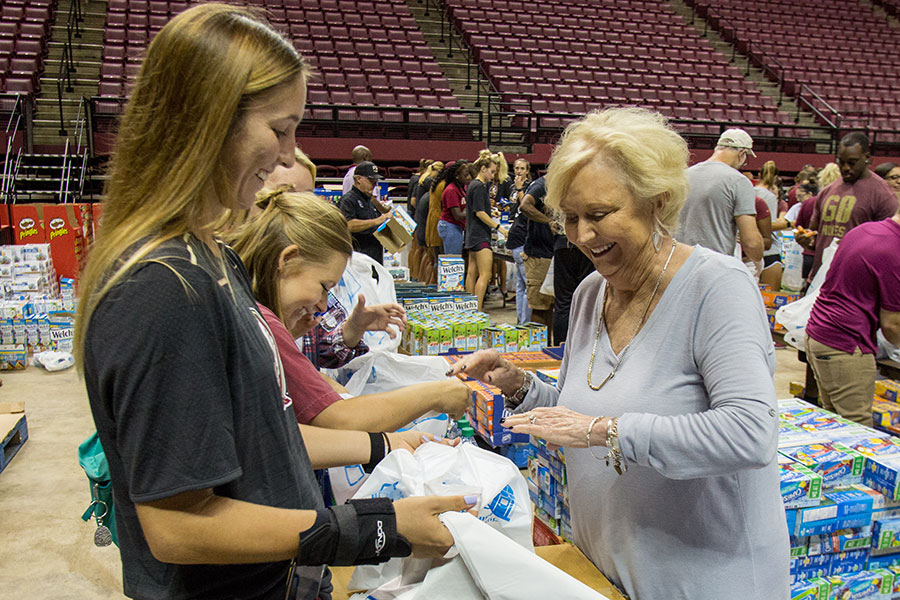 Mrs. Jean Thrasher helps make care packages with FSU students. (FSU Photography Services)