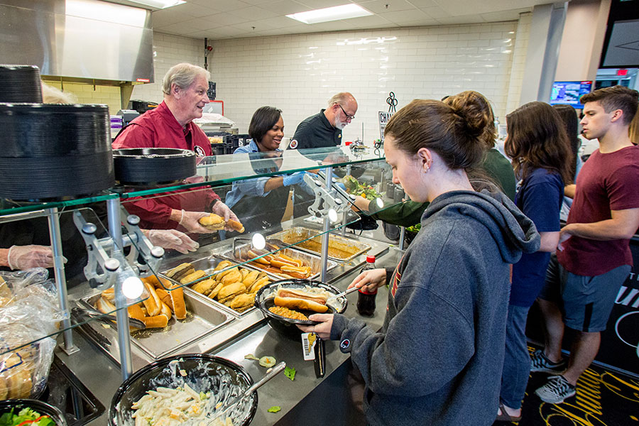 President Thrasher serves meals to grateful students following Hurricane Irma.