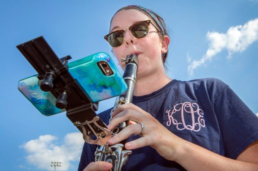 Katie Olney uses the eFlip mount on her clarinet during practice.