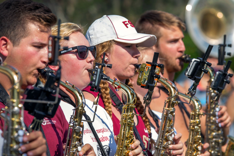 The Marching Chiefs are going green by using a new "eFlip" mount that allows band members to use smartphones or tablets for song music rather than printed sheet music. (FSU Photography Services)