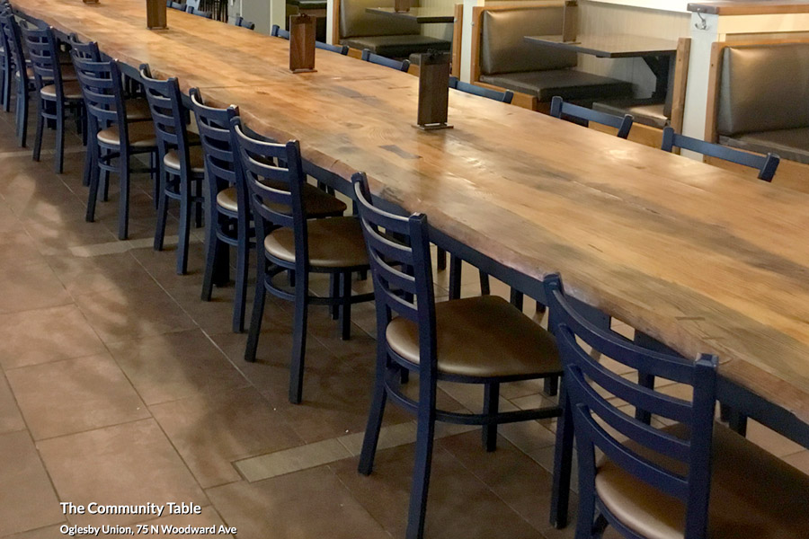 The pine table was milled at Boatright Timber Service in Havana, Florida. As the sawmill's workers tried to cut a colossal plank for the table, they kept breaking saws on something deep inside the trunk. The blockage turned out to be several century-old ceramic insulators that long ago were secured to the tree’s trunk to hold a telephone line for the first phone on campus in Bryan Hall. (Photo: Seminole Dining)