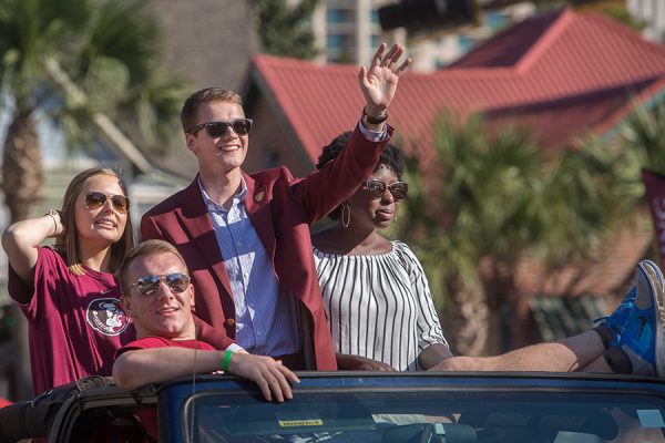 SGA President Kyle Hill (center) rides in the Florida State University 2017 Homecoming Parade. (FSU Photography Services)