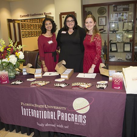 International Programs 60th Anniversary Dinner. (From left to right are Yasmine Chami, Dana Leger, and Katherine Thornton- International Programs student recruiters.) (Photo: FSU Photography Services)