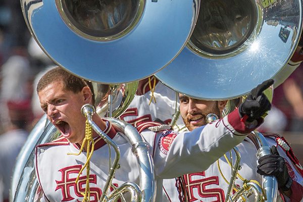 The Marching Chiefs' tuba squad run into position during their Homecoming performance.