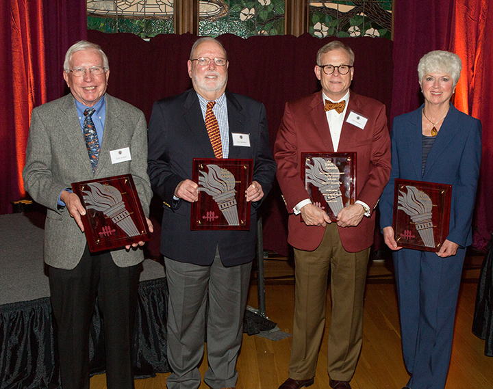 Four members of the FSU family were honored with Torch Awards on Monday, Dec. 4. From left: Kirby Kemper (Vires), Guy Spearman (Mores), Ash Williams (Mores) and Jan Moran (Vires). (Photo: Photography Services)