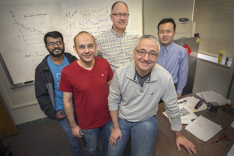 (From left) Graduate students Arun Polala and Navid Salehy, Professor and Director of Financial Mathematics Alec Kercheval, Professor Giray Okten and Assistant Professor Lingjiong Zhu are a part of one of the most well-respected financial mathematics programs in the nation. (FSU Photography Services)