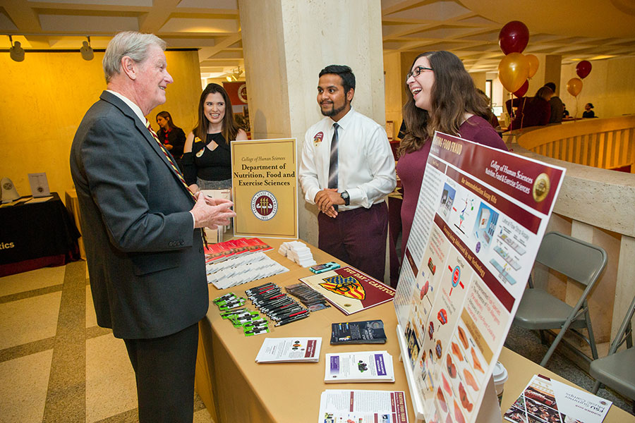 President John Thrasher visits information tables during FSU Day at the Capitol Feb. 6, 2018. (FSU Photography Services)