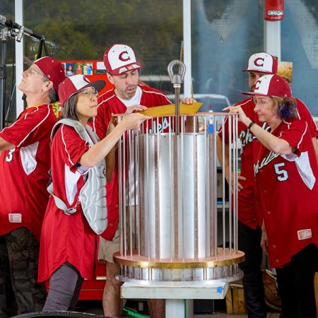 National MagLab Chief Scientist Laura Greene, far right, and other MagLab staffers donned baseball uniforms from Chiles High School to prove the point that science is team sport. They are pictured here building a magnet coil for one of the MagLab’s dozens of magnets.