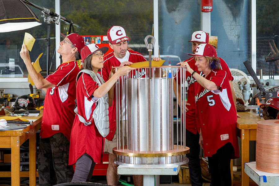 National MagLab Chief Scientist Laura Greene, far right, and other MagLab staffers donned baseball uniforms from Chiles High School to prove the point that science is team sport. They are pictured here building a magnet coil for one of the MagLab’s dozens of magnets.