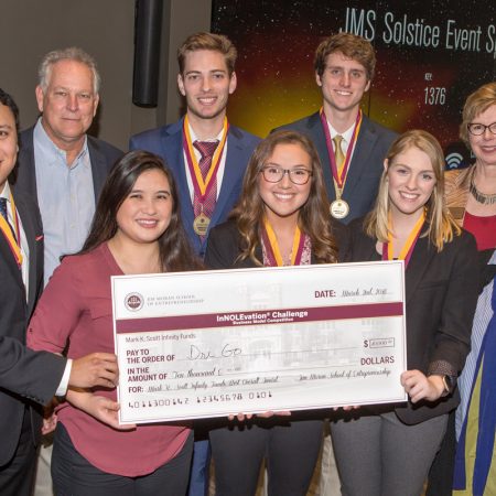 Members of the DriGo team: Jose Miranda (far left), Brianna Yeung (left center), Megan Simpson (center), Claire Kelly (right center), Susan Fiorito, Director, Jim Moran School of Entrepreneurship (far right) BACK ROW: Mark Scott (far left), Hunter Wheeler (left center), Billy Courson (right center), Wendy Plant, Jim Moran School of Entrepreneurship (far right)
