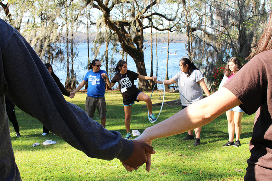 Participants and coordinators at LOGIC ramp up the energy with some unconventional icebreakers. (Photo: Rachel Mulcahy)