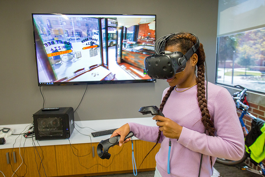 Student using the virtual reality equipment available at the new Innovation Hub in the Shores Building. (Photo: UC Photography Services)
