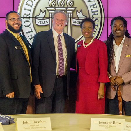 (From left to right) Tadarrayl Starke, the director of CARE, FSU President John Thrasher, KIPP Executive Director Jennifer Brown and Rashid Williams, an FSU alumnus and KIPP manager of college placement and a partnership signing with KIPP Jacksonville. (Photo: FSU Photography Services)