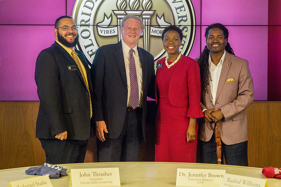 (From left to right) Tadarrayl Starke, the director of CARE, FSU President John Thrasher, KIPP Executive Director Jennifer Brown and Rashid Williams, an FSU alumnus and KIPP manager of college placement and a partnership signing with KIPP Jacksonville. (Photo: FSU Photography Services)