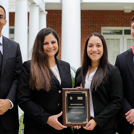 Third-year law students Jenna VonSee and Brenda Czekanski won a national moot court competition March 23-24. They were coached by College of Law alumni Jonathan Martin (left) and Ian Waldick (right),