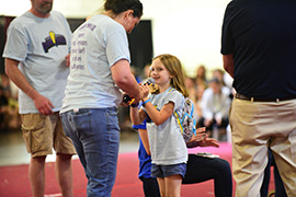 Miracle Child Powie speaking to the dancers. (Photo: DM at FSU)