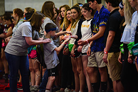 Miracle Child Nate cutting bands off of dancers. (Photo: Andrew Salinero, DM at FSU)