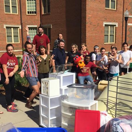 Volunteers from last year's Chuck It For Charity event stand by a collection of items from one of the residence halls. (Photo: FSU Sustainable Campus)