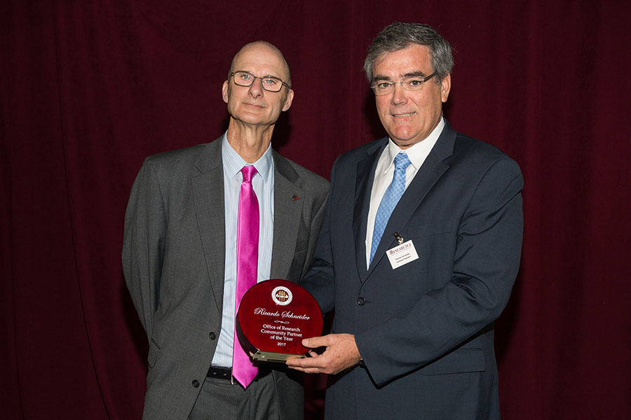 Vice President for Research Gary Ostrander and Danfoss Turbocor Compressors President Ricardo Schneider, winner of the FSU Office of Research Community Partner of the Year Award April 3. (FSU Photography Services)