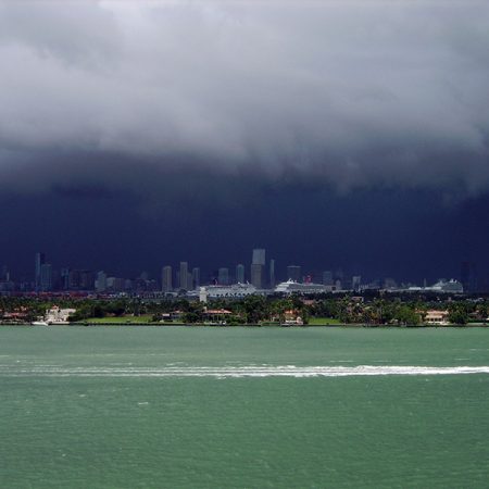 A summer storm gathers over Miami. Misra found that large urban areas are experiencing shorter, more intense wet seasons than rural or less developed areas.