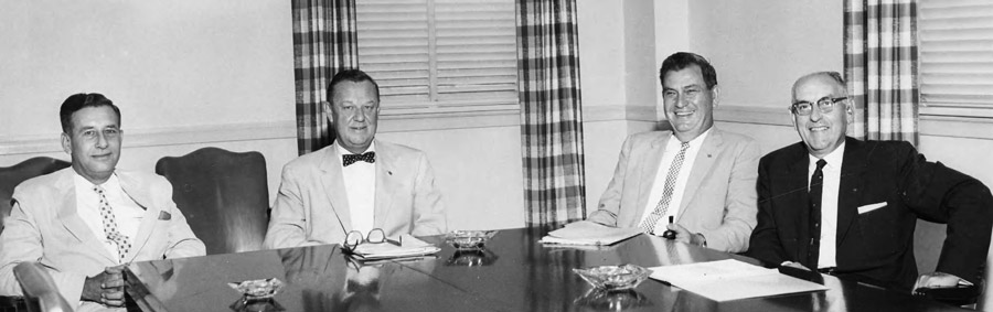 This is a photograph of Charles Davis, Robert Manning Strozier, R. Ross Oglesby, and Rod Shaw seated around a conference table.