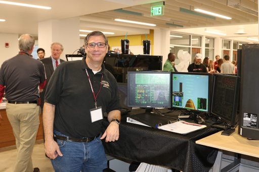 FSU Ph.D. student and Florida State University School teacher, Peter Carafano won Best in Show for Innovation for his space flight simulator at DIGITECH. (Photo: University Communications)