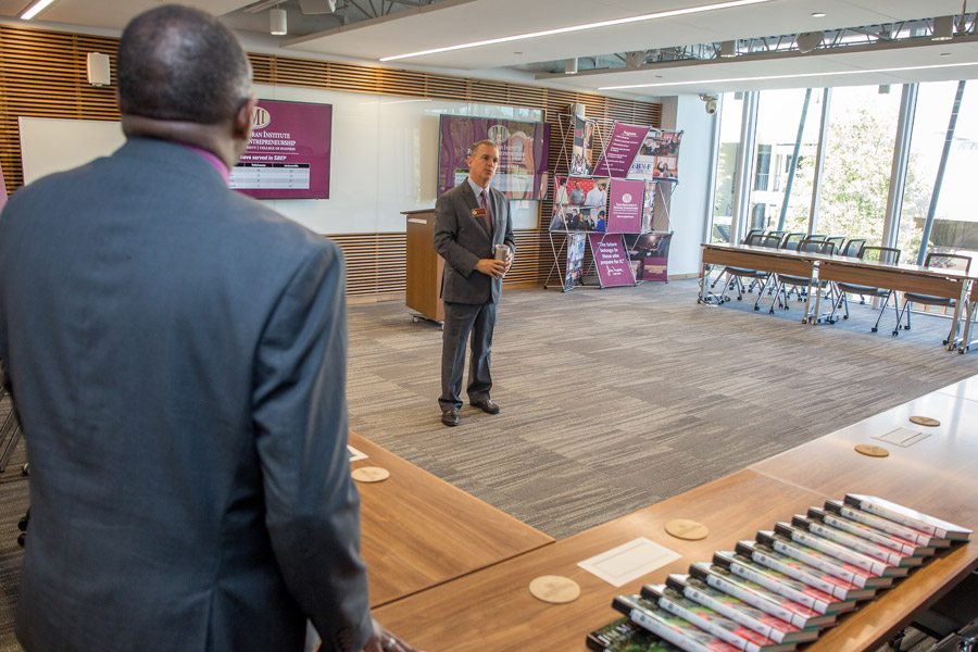 Mike Campbell, director of North Florida Operations for the Jim Moran Institute for Global Entrepreneurship, greets visitors during an open house on May 1, 2018. (FSU Photography Services)