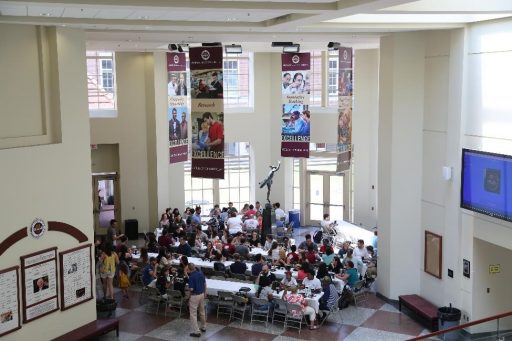 New FSU medical students gather for a welcome picnic in the atrium of the College of Medicine's John Thrasher Building.