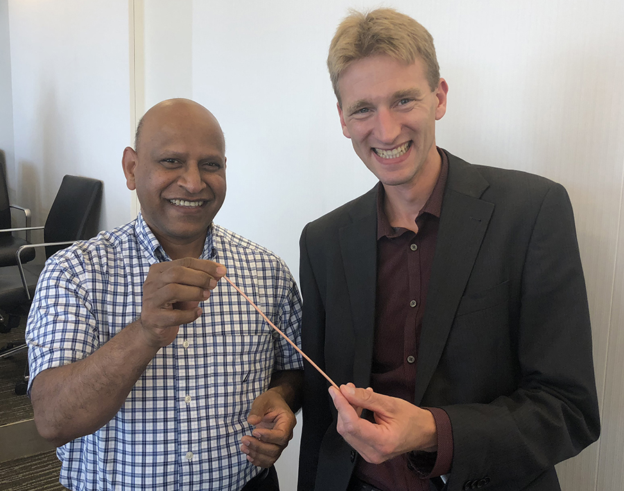 FAMU-FSU College of Engineering Professor and Associate Director of CAPS Sastry Pamidi and Danko van der Laan, president and CEO Advanced Conductor Technologies, show off Conductor on Round Core cable technology.