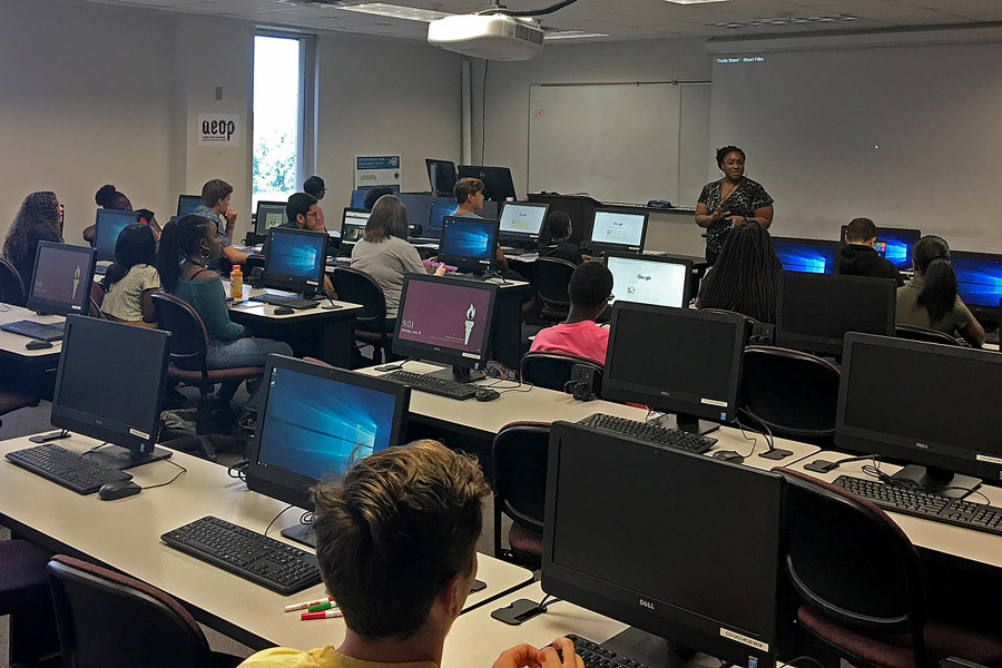iSchool instructor Christy Chatmon helps high school students from Leon and Gadsden counties learn tech skills at FSU iCamp, hosted in partnership with the U.S. Army Educational Outreach Program. (Photo: College of Communication and Information)