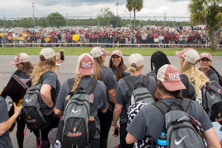 FSU softball players greet fans gathered at Tallahassee International Airport to welcome home the NCAA Softball National Champions on June 6, 2018. (FSU Photography Services)