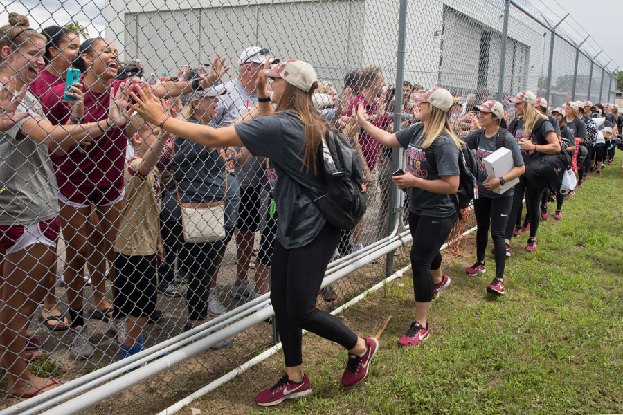FSU softball players greet fans gathered at Tallahassee International Airport to welcome home the NCAA Softball National Champions. (FSU Photography Services)