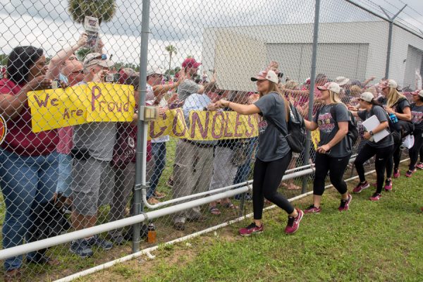 FSU softball players greet fans gathered at Tallahassee International Airport to welcome home the NCAA Softball National Champions on June 6, 2018. (FSU Photography Services)